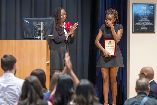 Female student reacts after winning an award