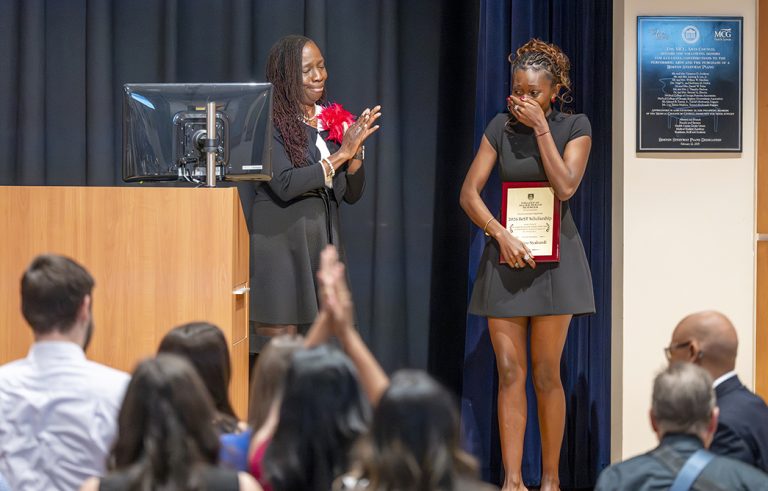 Female student reacts after winning an award