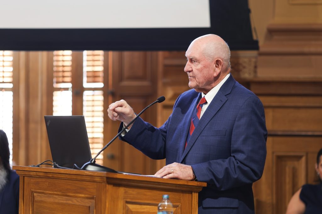 Man speaking at podium
