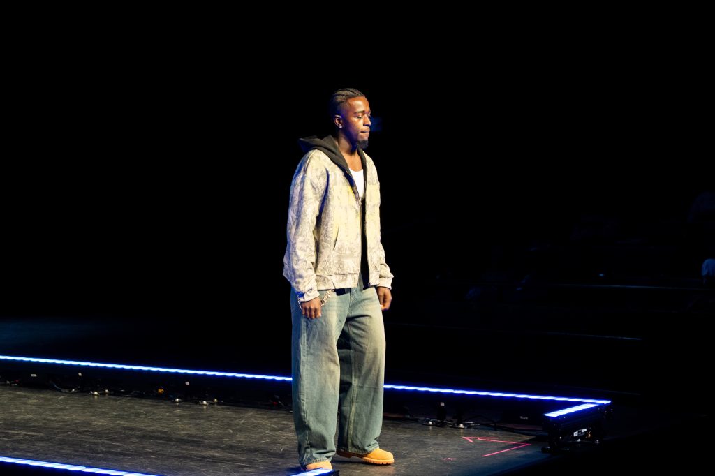 A man poses at the end of a runway