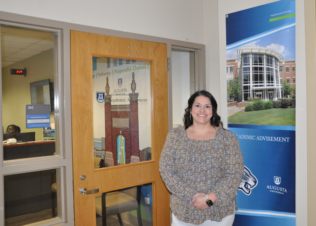 Woman standing in front of a door