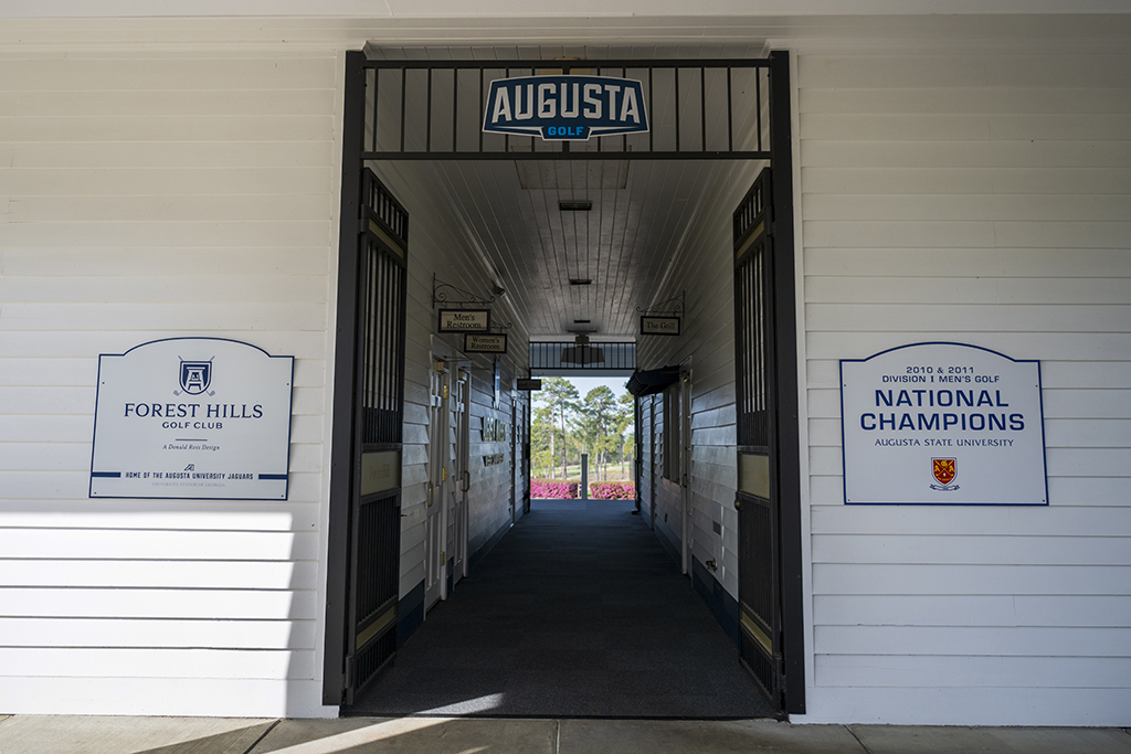Entry way with two signs posted on either side