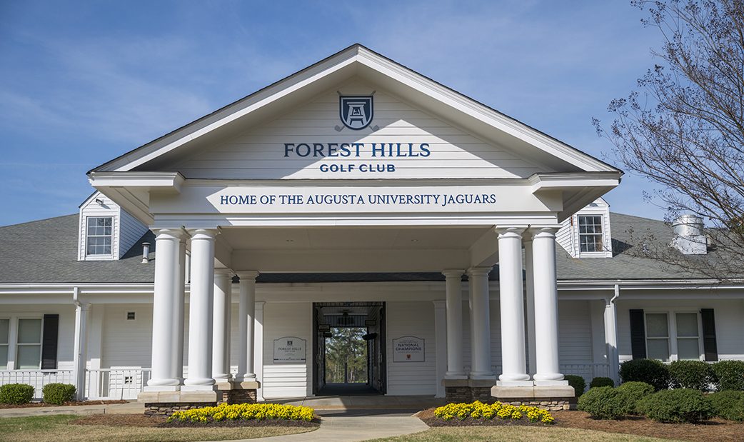 Front of building with new signage posted above the entry way