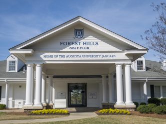 Front of building with new signage posted above the entry way