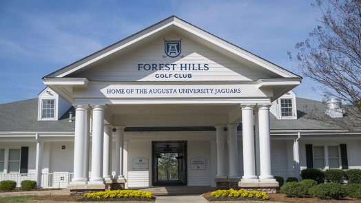 Front of building with new signage posted above the entry way