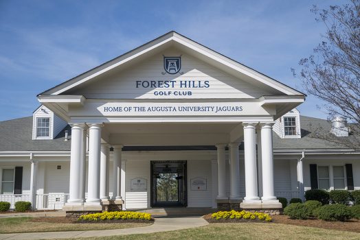 Front of building with new signage posted above the entry way
