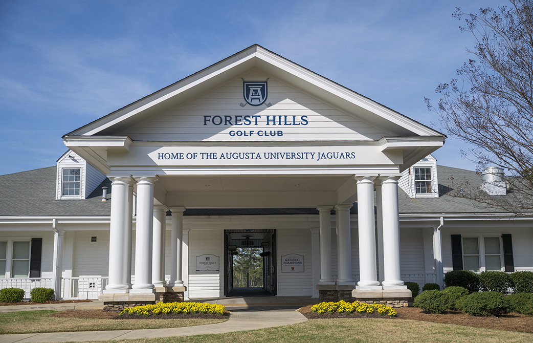 Front of building with new signage posted above the entry way