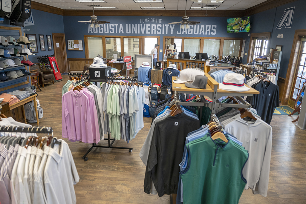 Merchandise hanging on racks in the pro shop