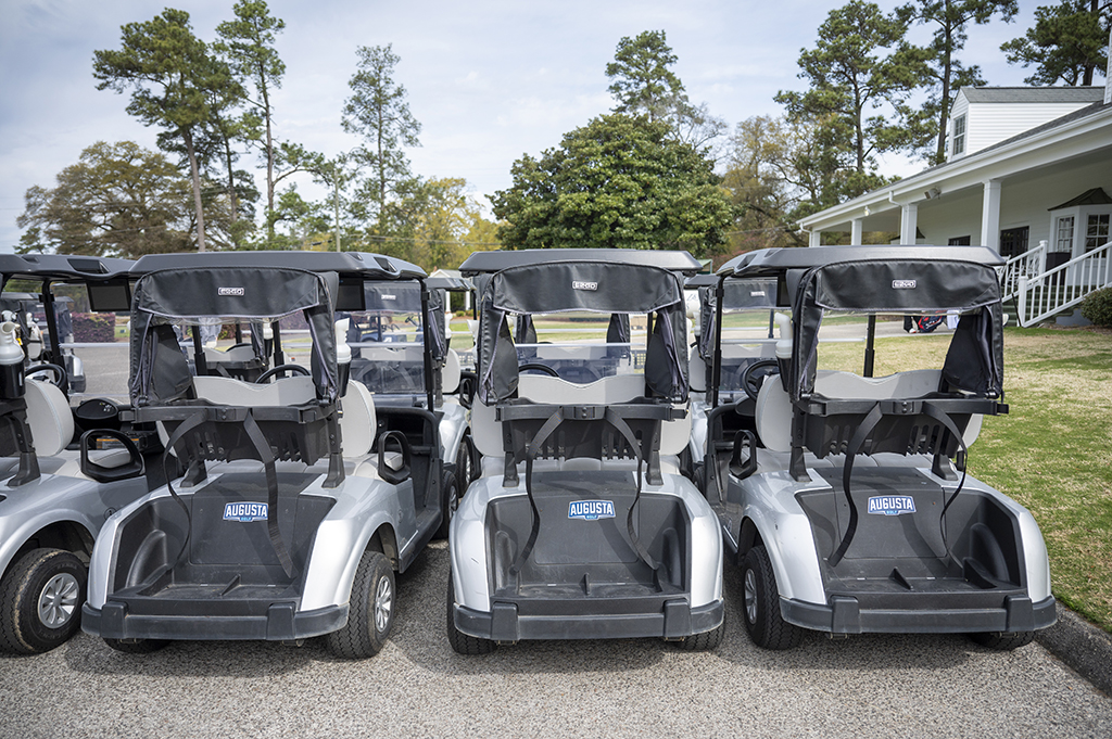Golf carts parked in a row