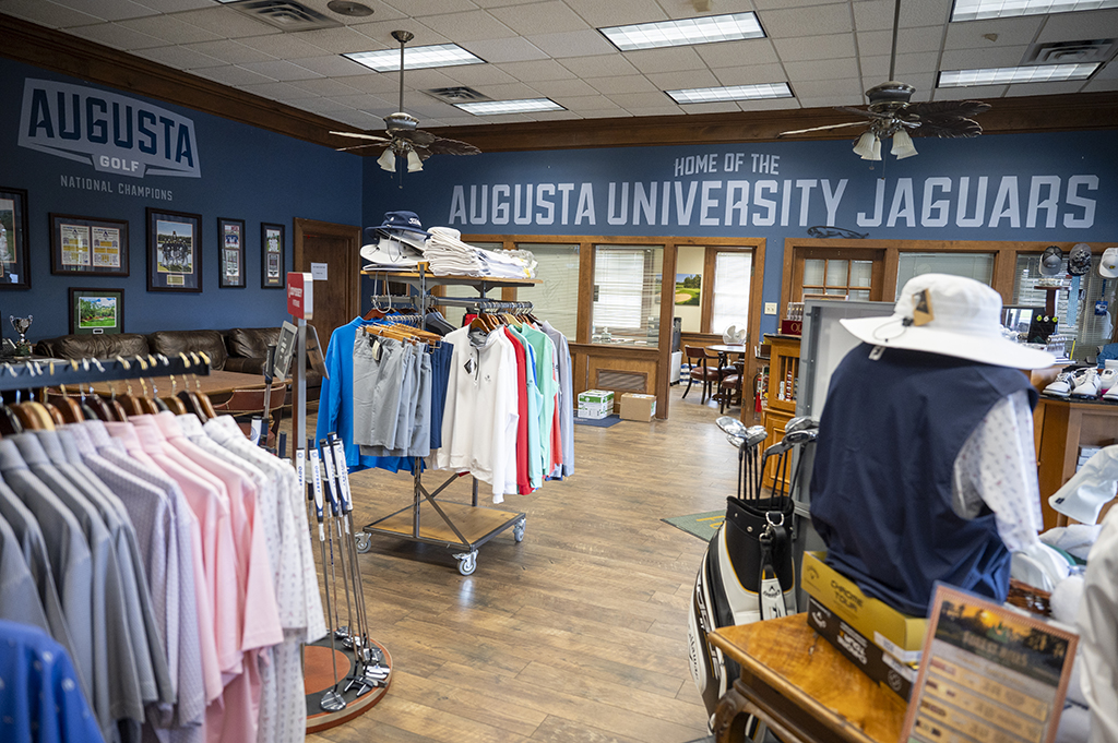 Merchandise hanging on racks in the pro shop