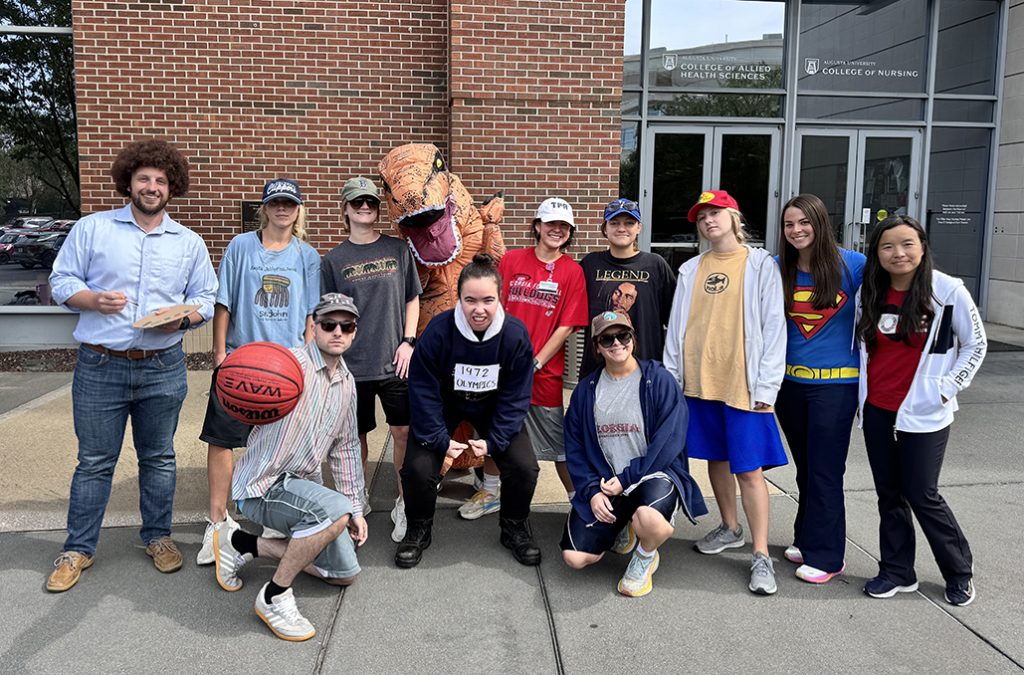 Men and women dressed in costumes