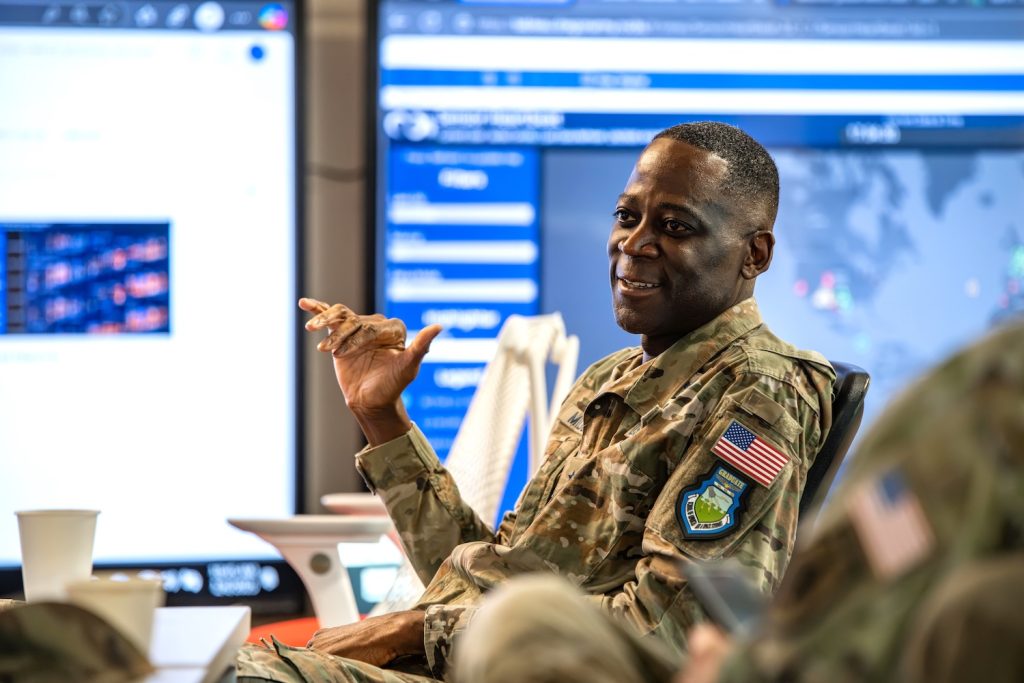 Brigadier General sitting and talking