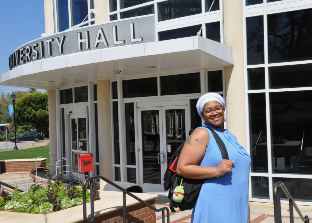 Woman standing outside of a building