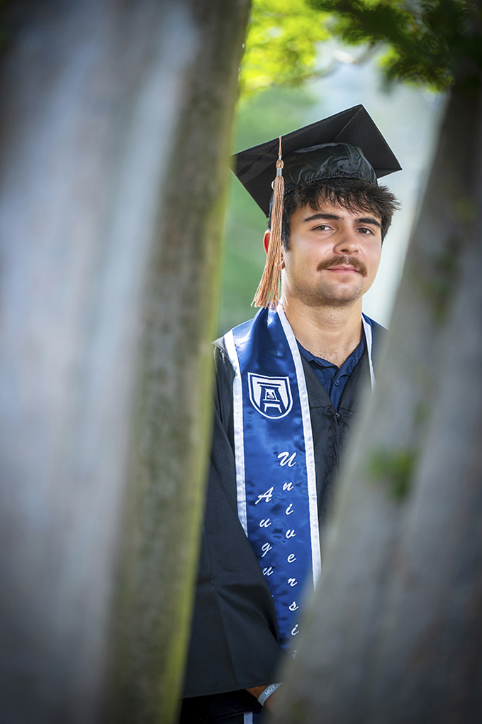 Man posing for graduation photos