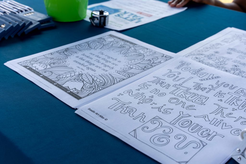 Coloring sheets on a table.