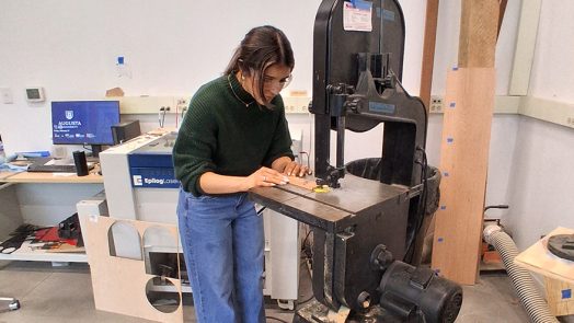 Woman working with a wood cutter