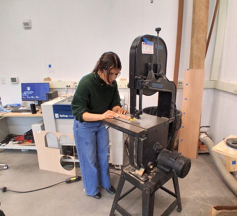 Woman working with a wood cutter