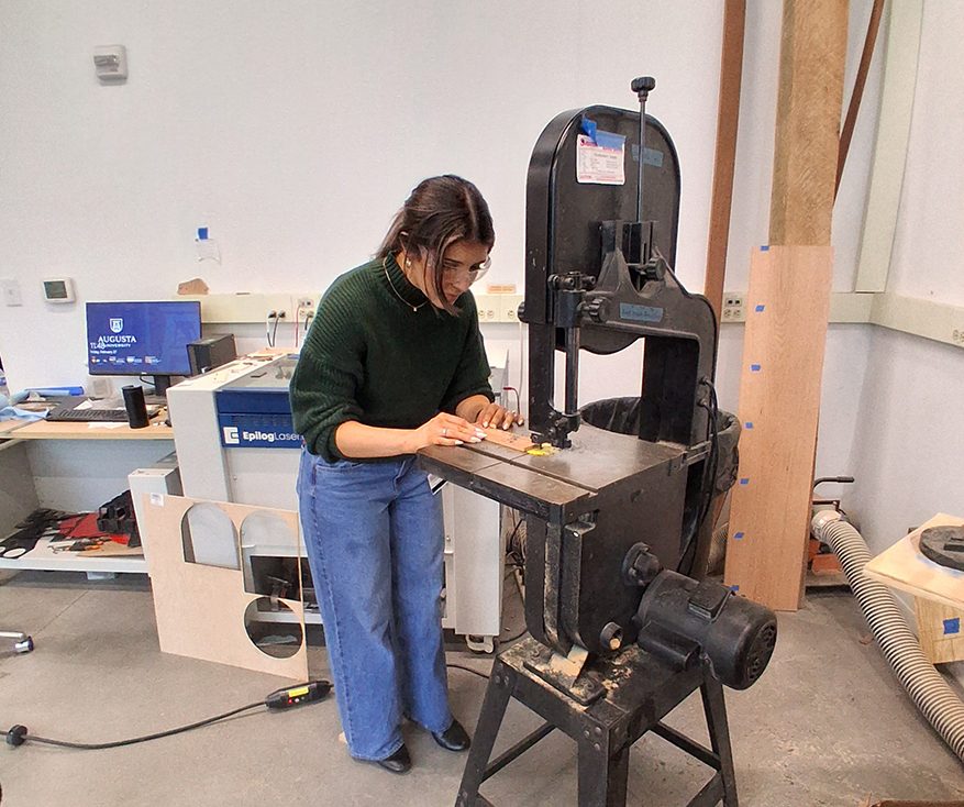 Woman working with a wood cutter