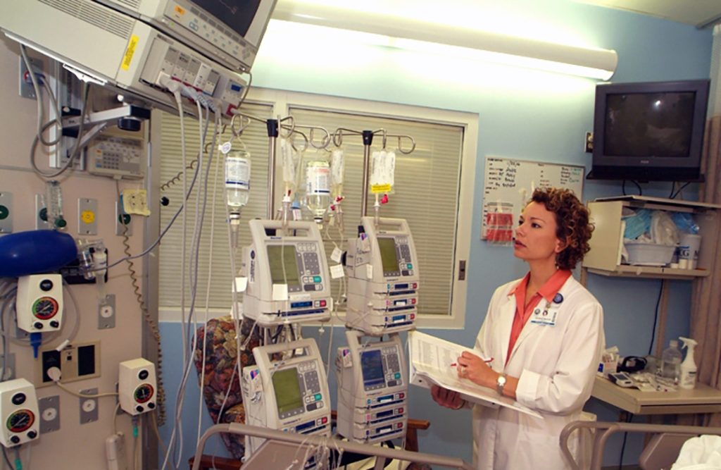 A woman looking at health monitors