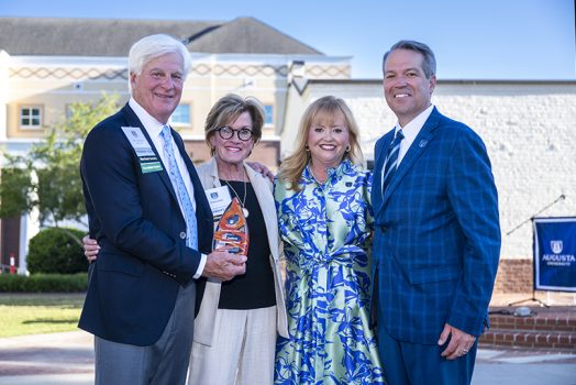 Two smiling couples