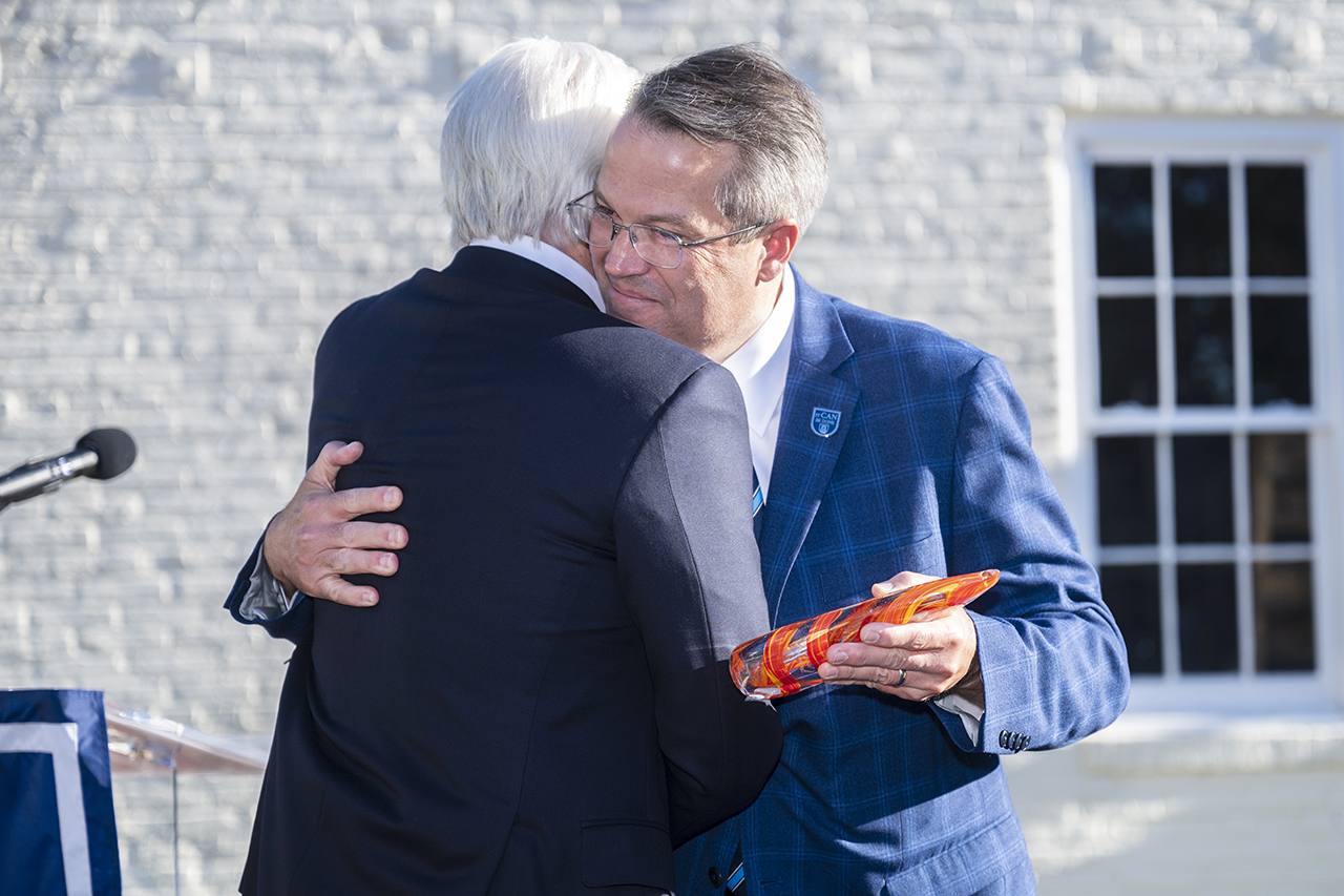 Two men hugging