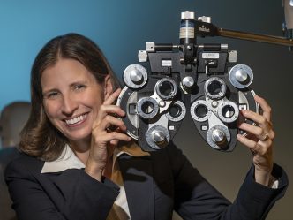 Woman holding ophthalmology equipment in her hands