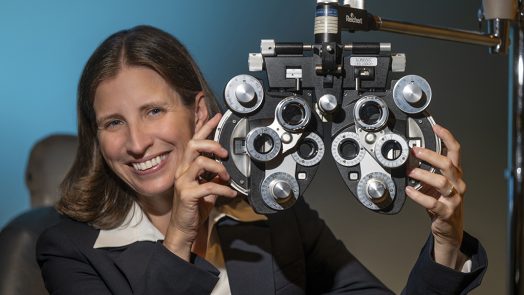 Woman holding ophthalmology equipment in her hands