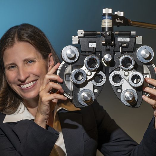 Woman holding ophthalmology equipment in her hands