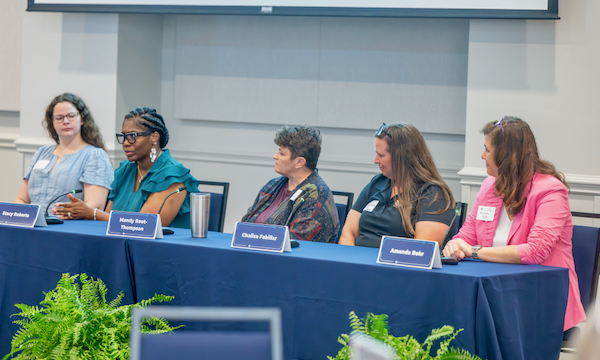 A panel of five women