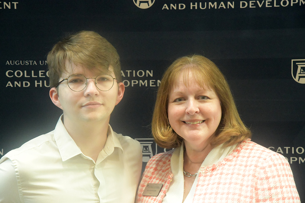 A man and woman pose for a photo