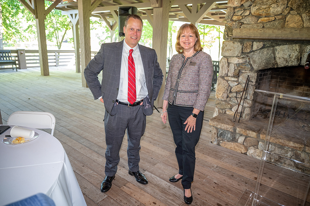 A woman and a man pose for a photo
