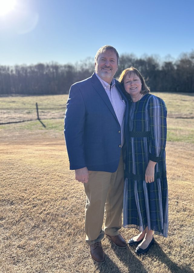 Man and woman standing in a field