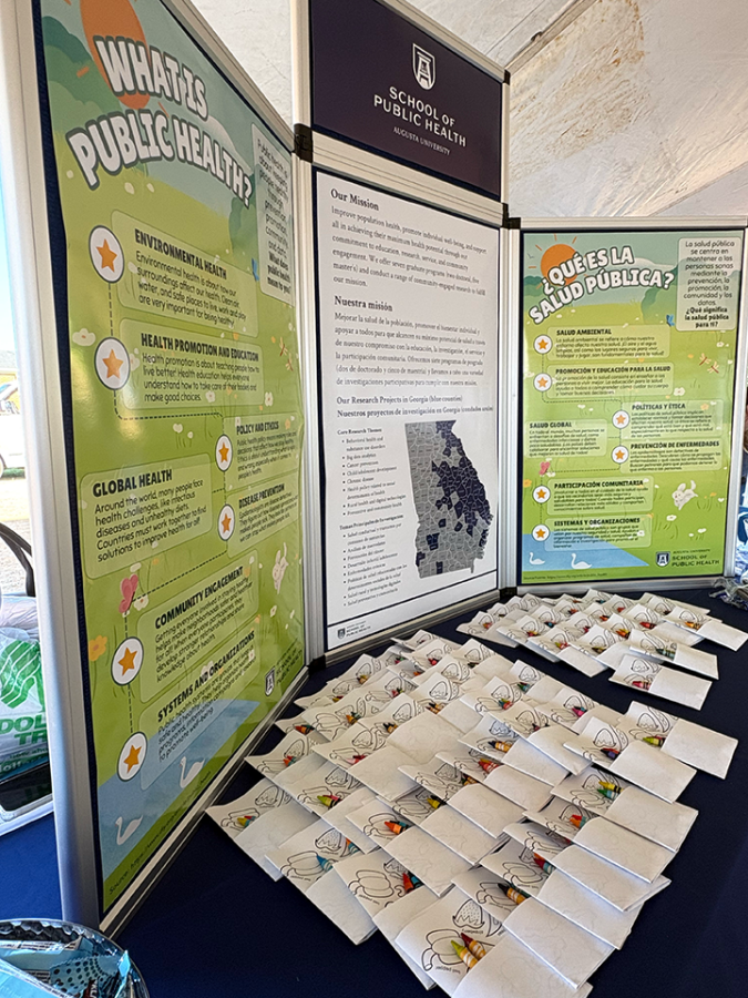 Posters set up on a table describing what Public Health is.