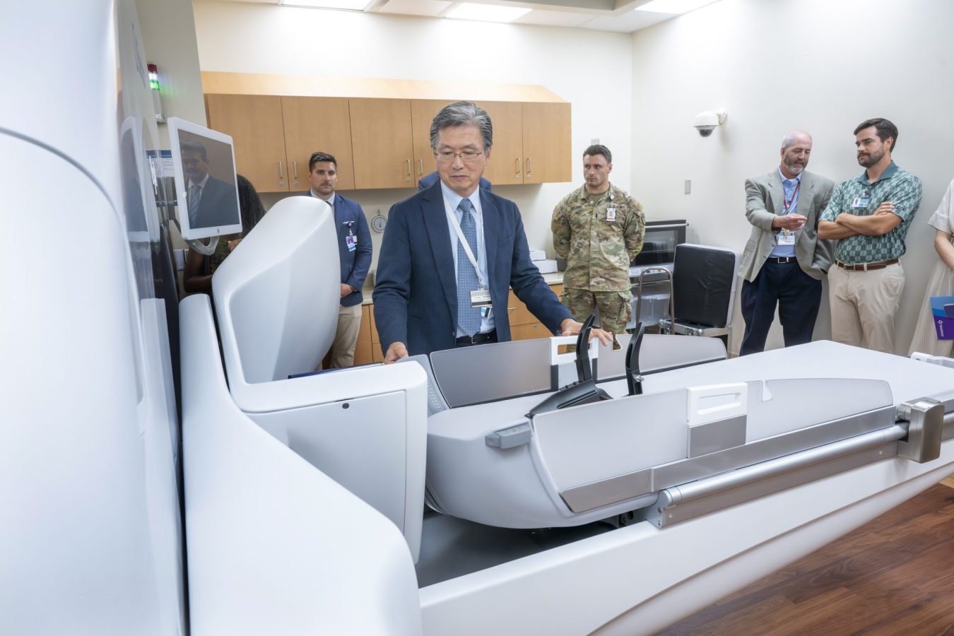 In this photo, you see Dr. Chulhaeng Huh giving a tour of the new Elekta Esprit Gamma Knife machine.