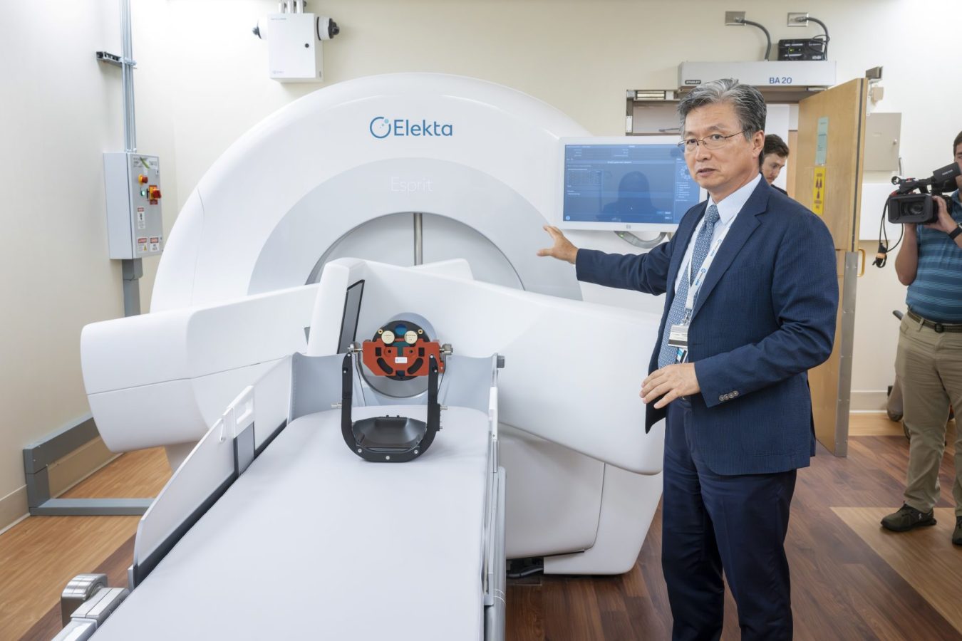 In this photo, you see Dr. Chulhaeng Huh giving a tour of the new Elekta Esprit Gamma Knife machine.