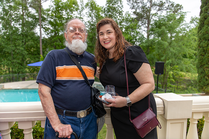 Man and woman outside smiling