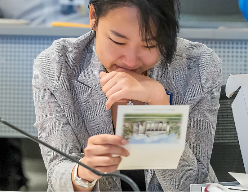 young woman reads notecard