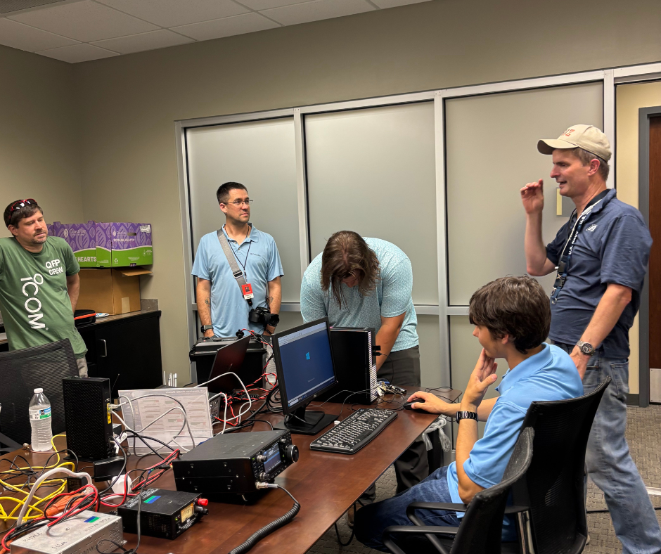 Club advisor talks to student organization members about amateur radio. 