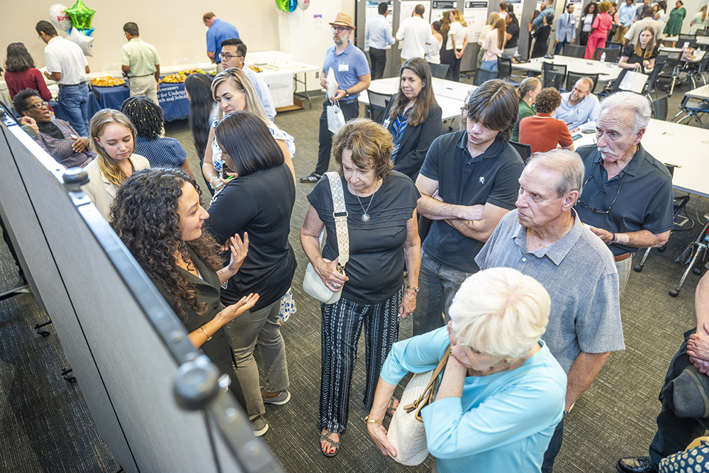 woman speaking with a group of people