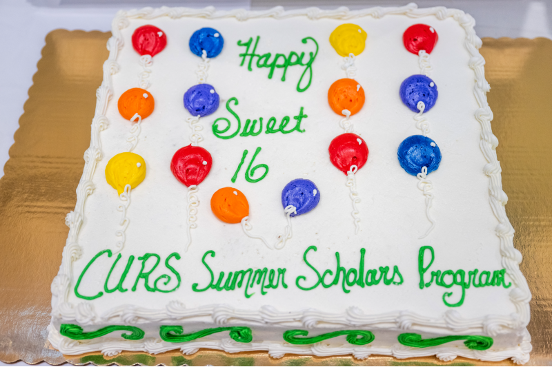 cake with colorful balloons
