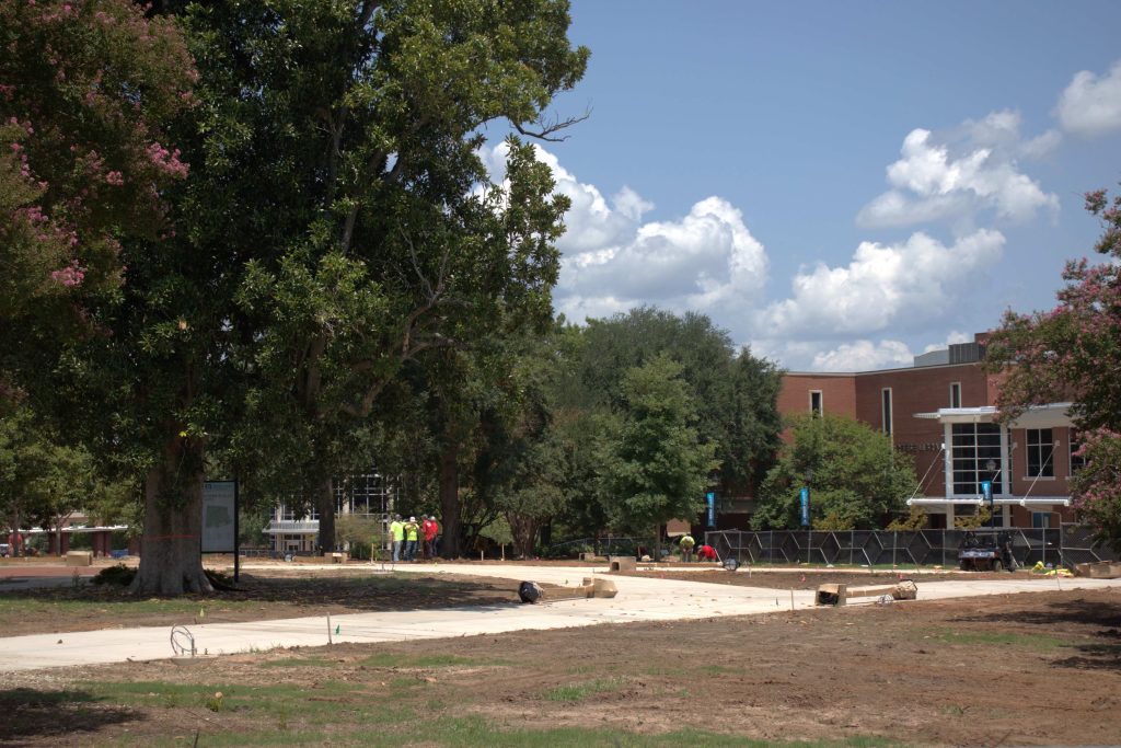 Outdoor construction taking place on sidewalks.