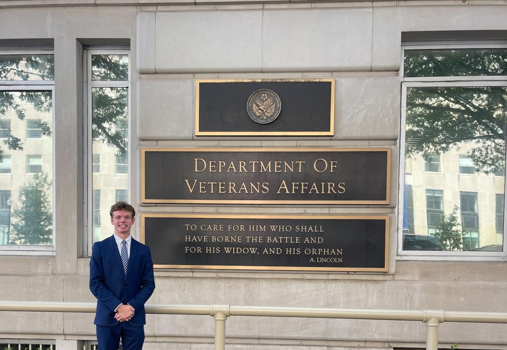 Man standing in front of the VA