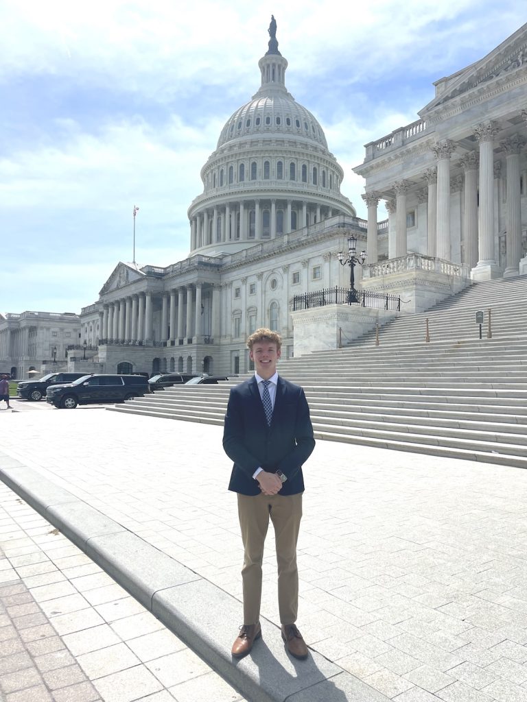 Person standing in front of the U.S. Capitol Building