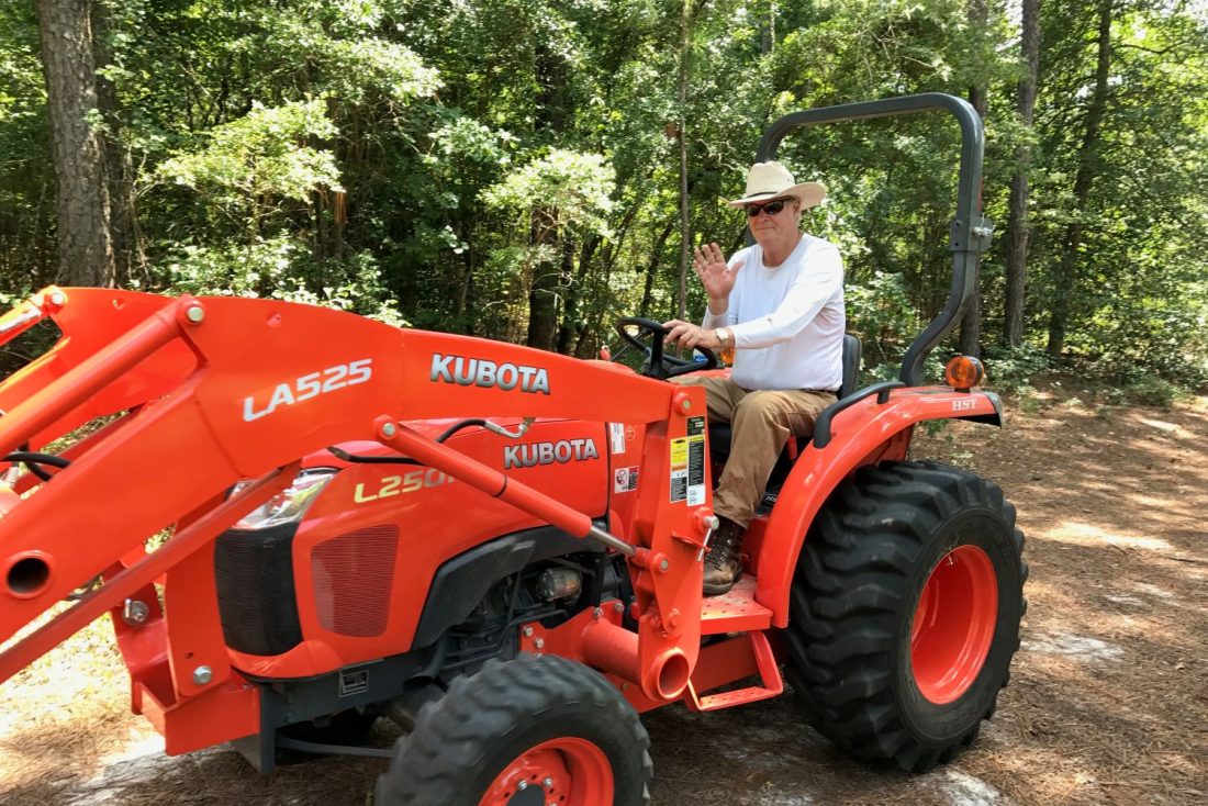 man drives tractor