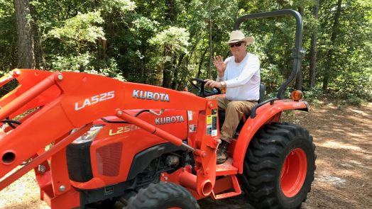 man drives tractor