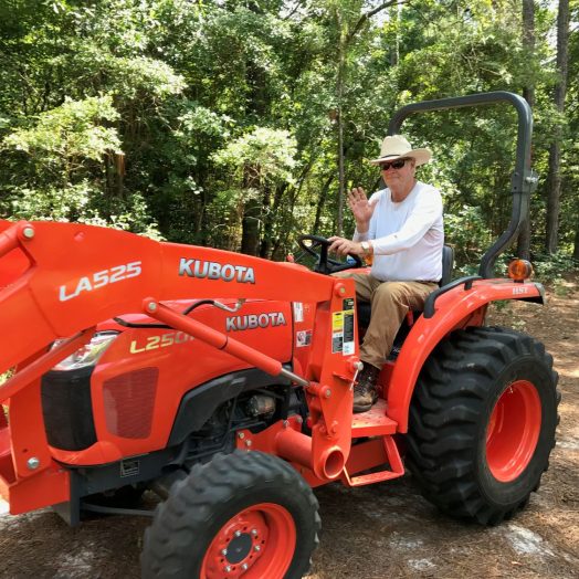 man drives tractor