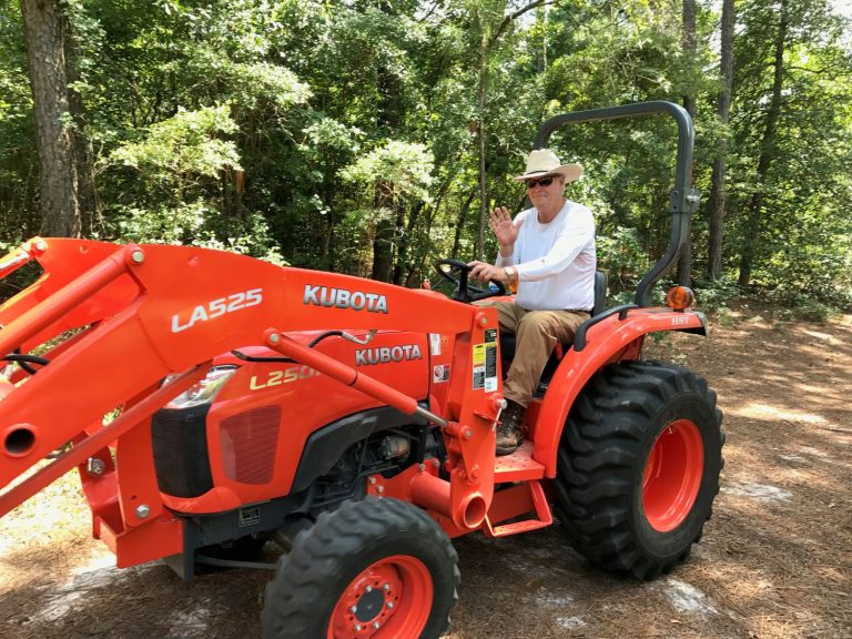 man drives tractor
