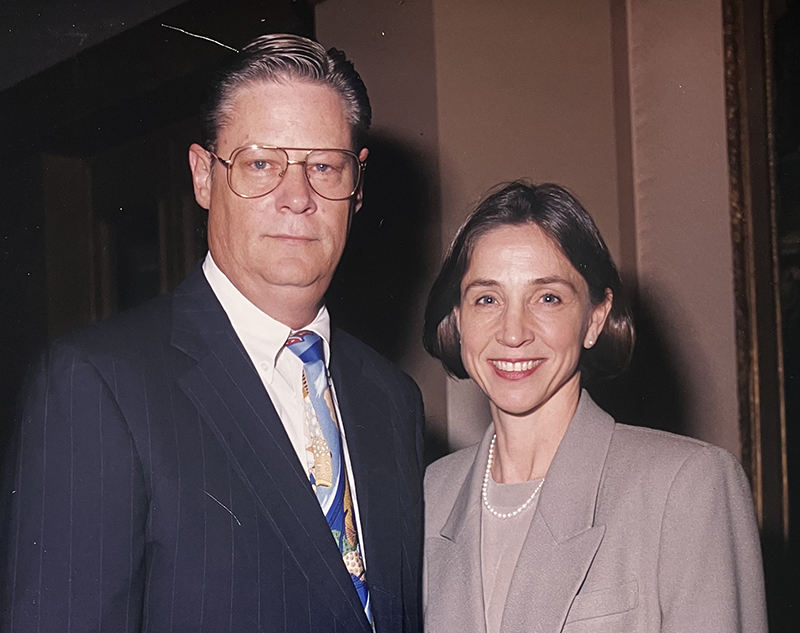 man and woman in dress clothes