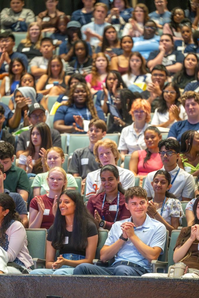 group of students seated in an auditorium
