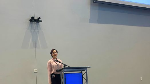 woman talking behind podium